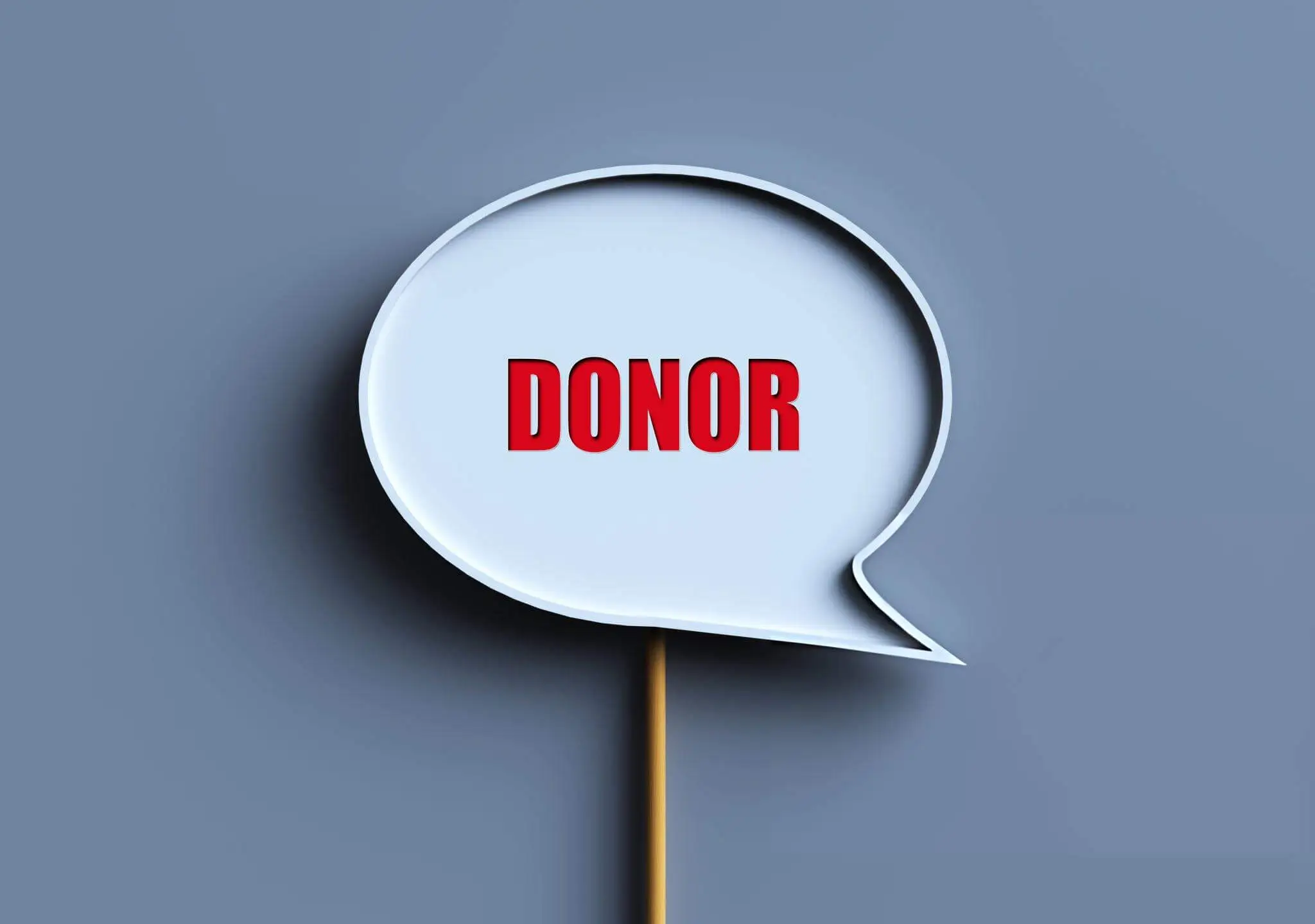 Bold red text in a speech bubble reading "DONOR" with a gray background, visually emphasizing the concept of donor stem cells.