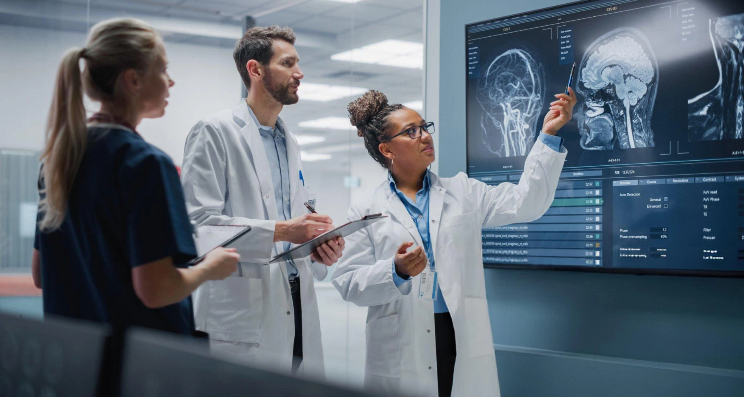 Medical professionals analyzing brain scans together—illustrating R3 Stem Cell’s commitment to advanced diagnostics and collaborative regenerative care in Norfolk