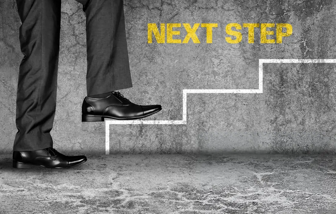 A person taking the "next step" up a staircase drawn on a wall, symbolizing the journey toward recovery and the positive next step with stem cell therapy in Newport News, VA.