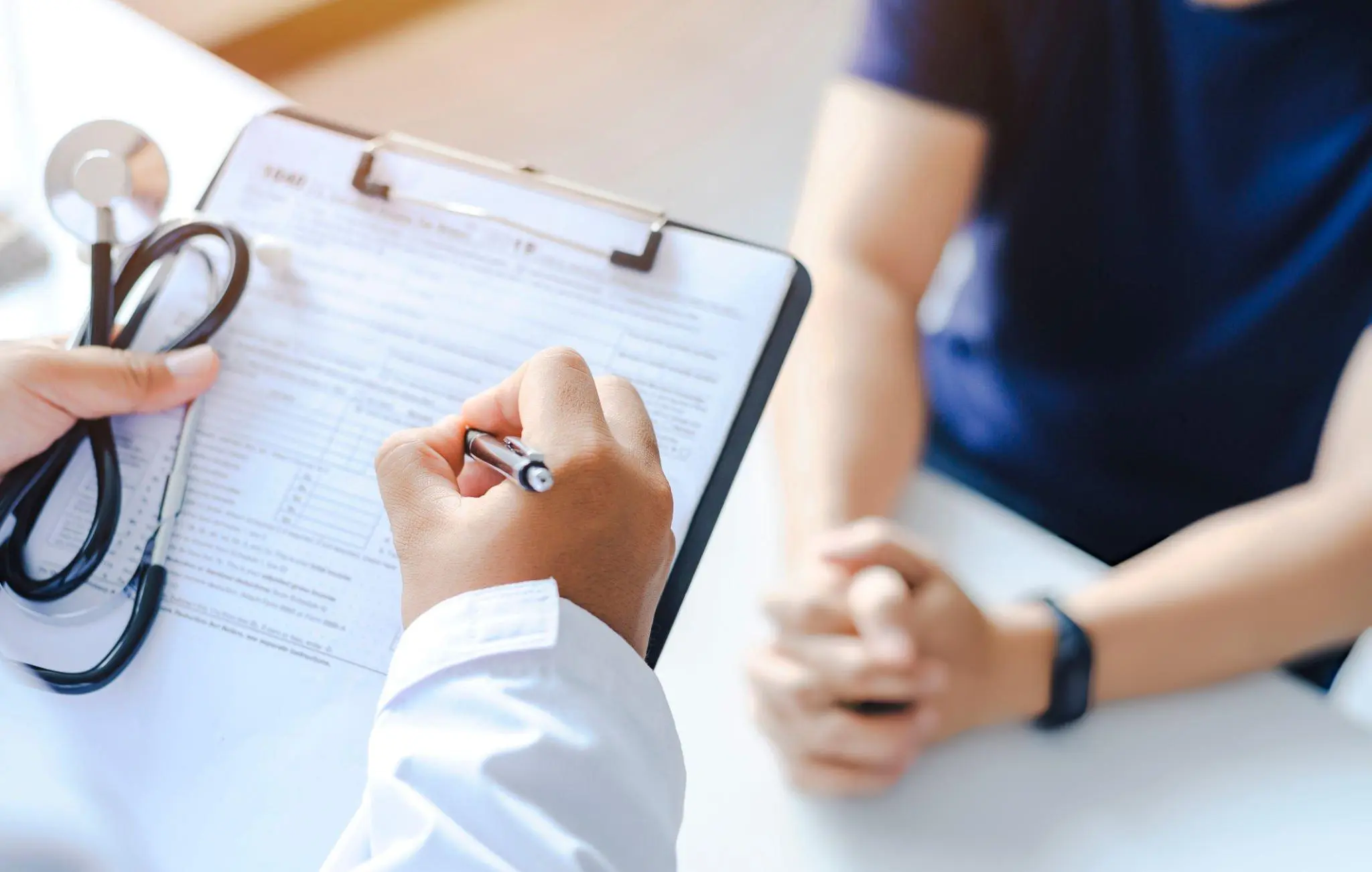 Doctor consulting patient—representing stem cell therapy for joint pain and mobility issues in Albuquerque