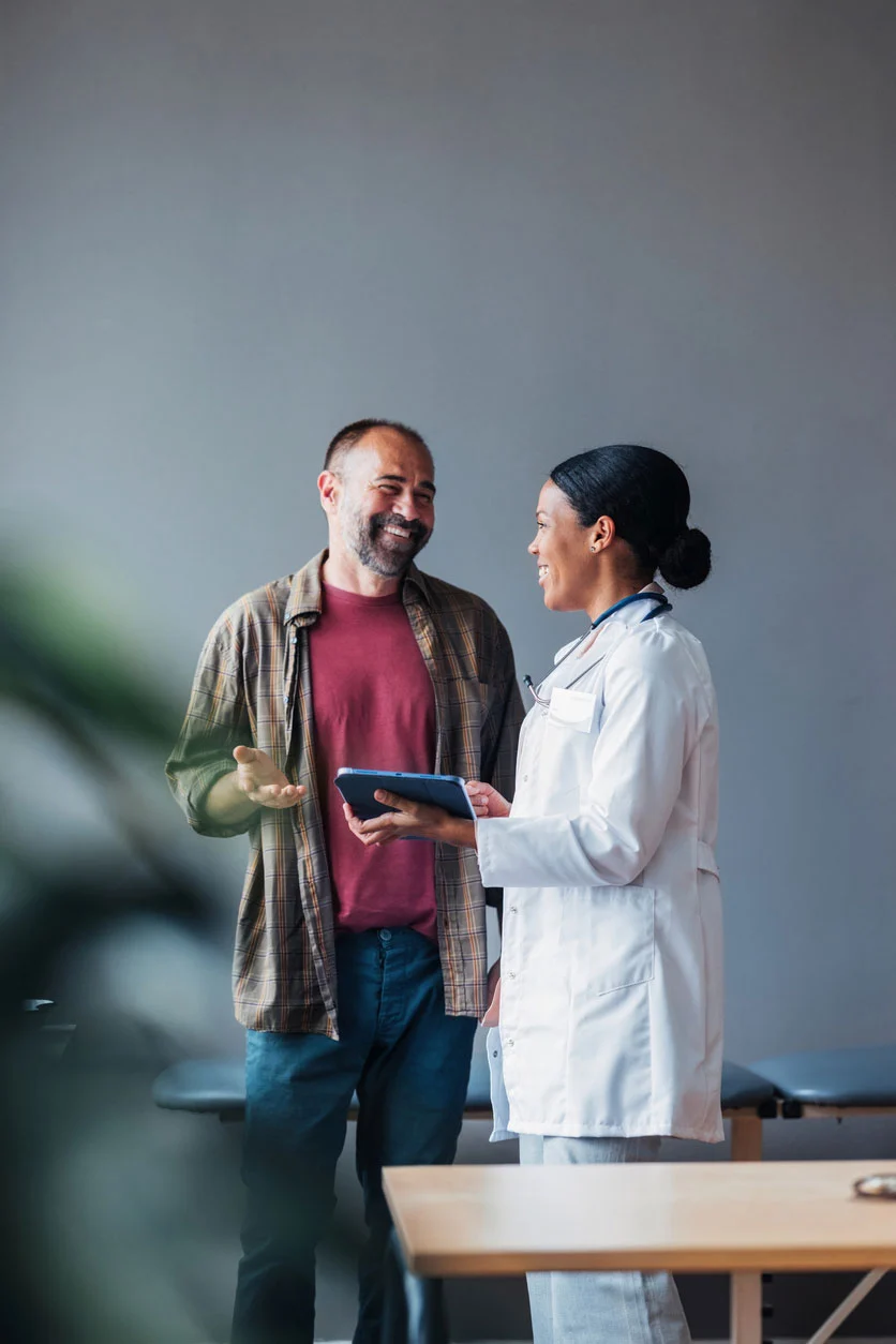 Friendly doctor and patient discussing treatment at stem cell clinic in Charlotte NC