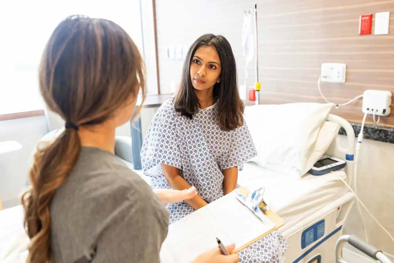 Physician consulting with patient about personalized stem cell therapy treatment plan in a clinical setting