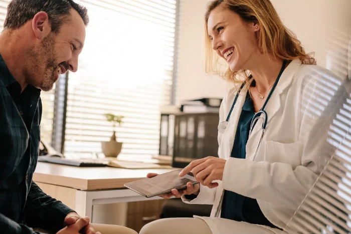 Expert doctor explaining exosome therapy benefits to a patient in Nashville TN
