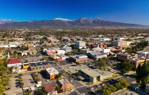 Aerial view of downtown Pomona, California with San Gabriel Mountains in the background