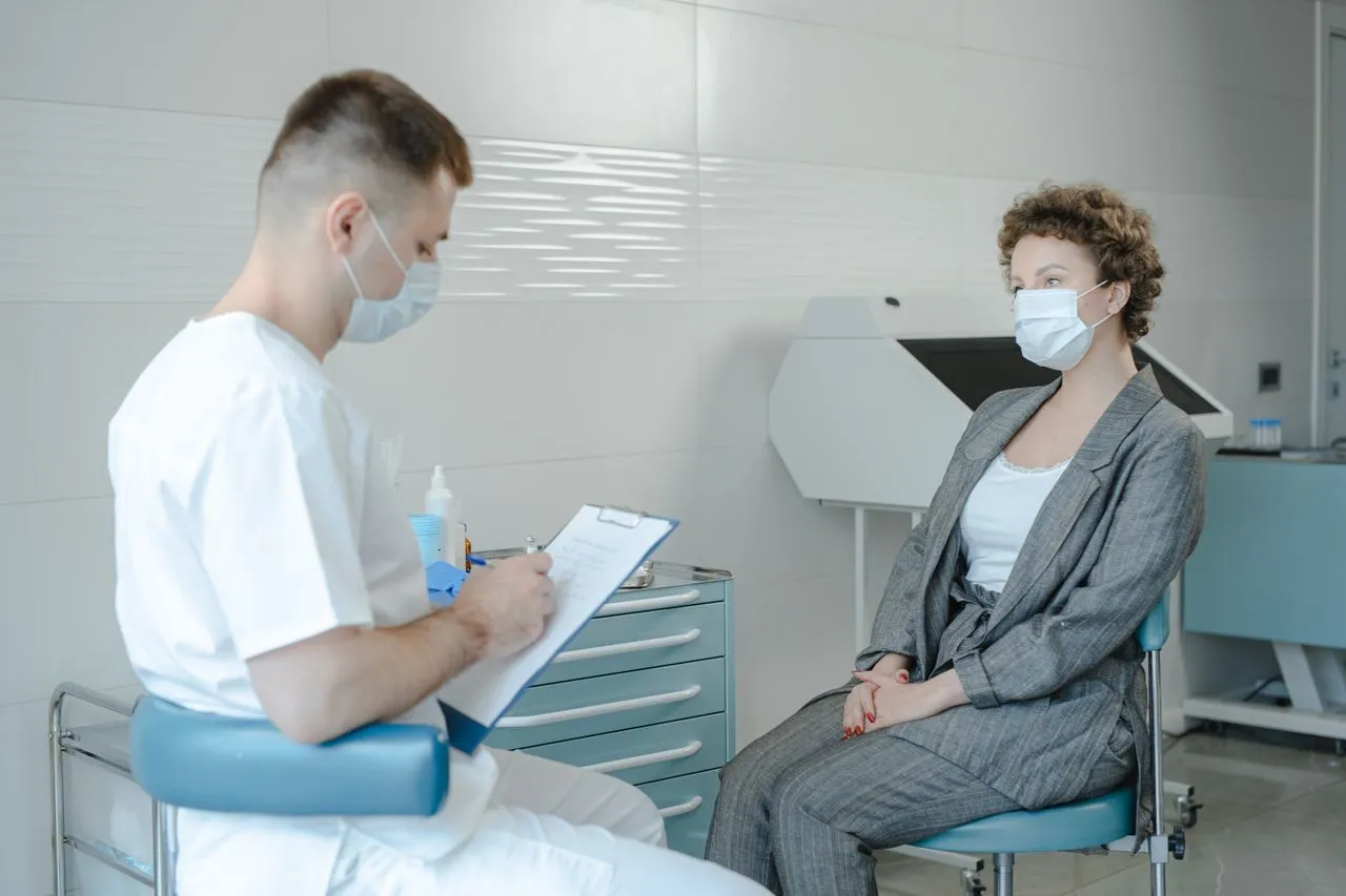 A doctor is inquiring about a patient's medical condition before treating her with stem cell therapy