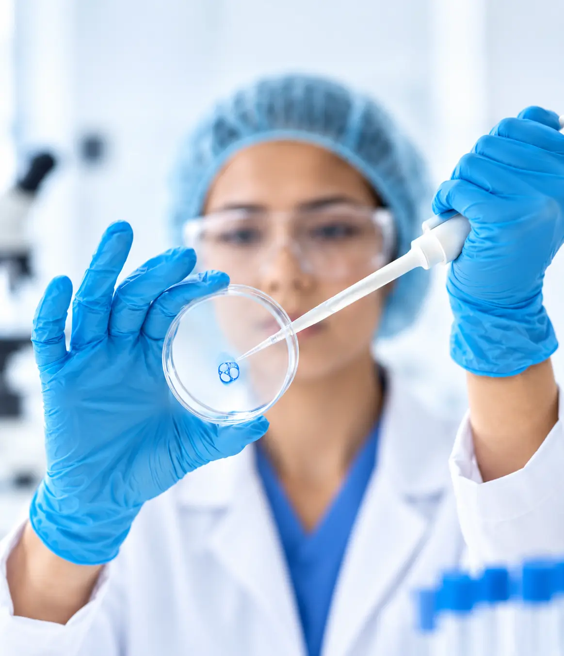 Lab technician testing stem cell sample in petri dish