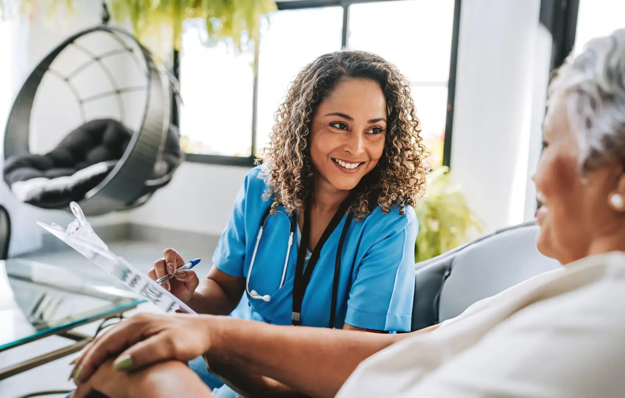 Nurse answering a Milwaukee patient's questions about stem cell therapy during a friendly consultation